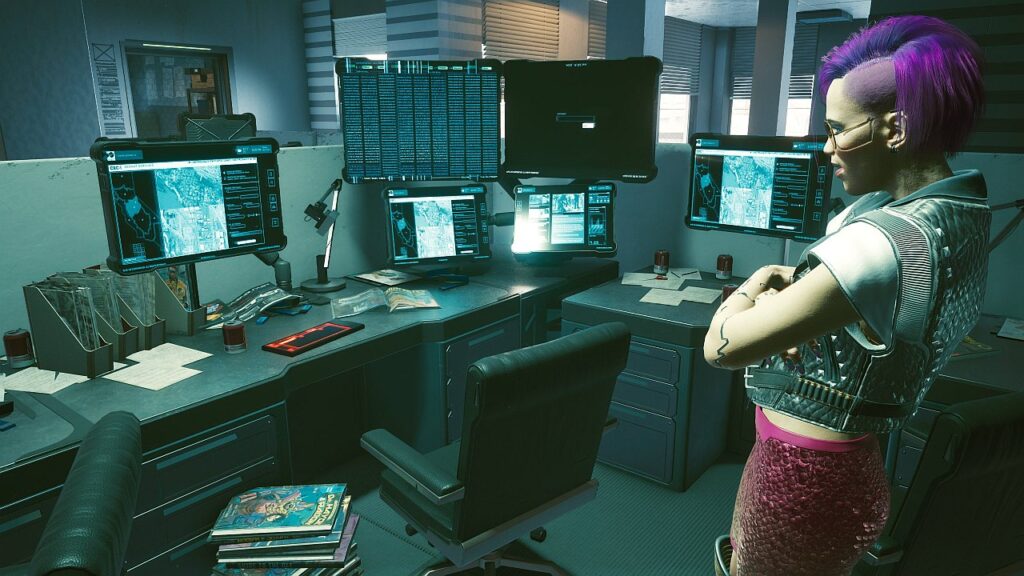 Screenshot aus dem Spiel Cyberpunk 2077 von Nastja the blogging Mox. Weibliche Cyberpunk V steht in einem Büro vor vielen Bildschirmen. Symbolbild für die Rubrik Kontakt..