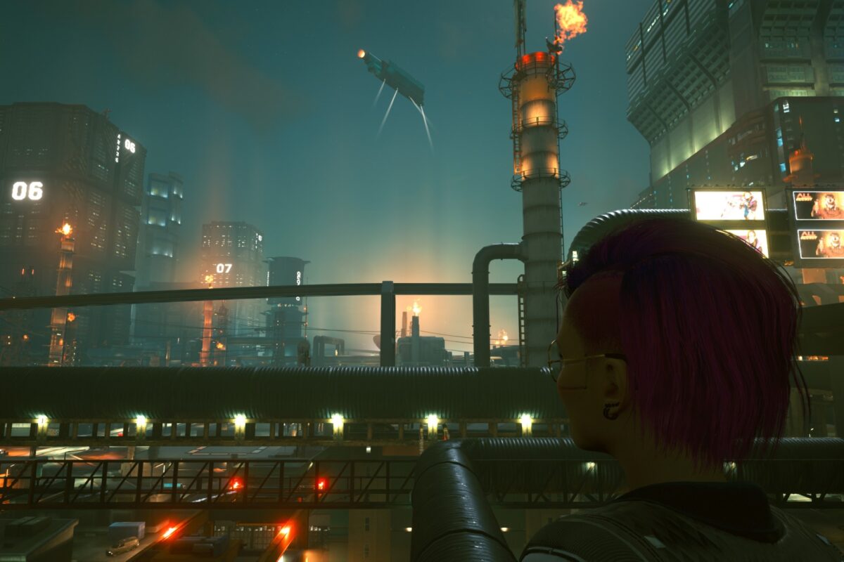 Industriegebiet mit Megatower in Hintergrund in der Nacht. Screenshot aus dem Spiel Cyberpunk 2077 im Blog von Nastja der Mox.