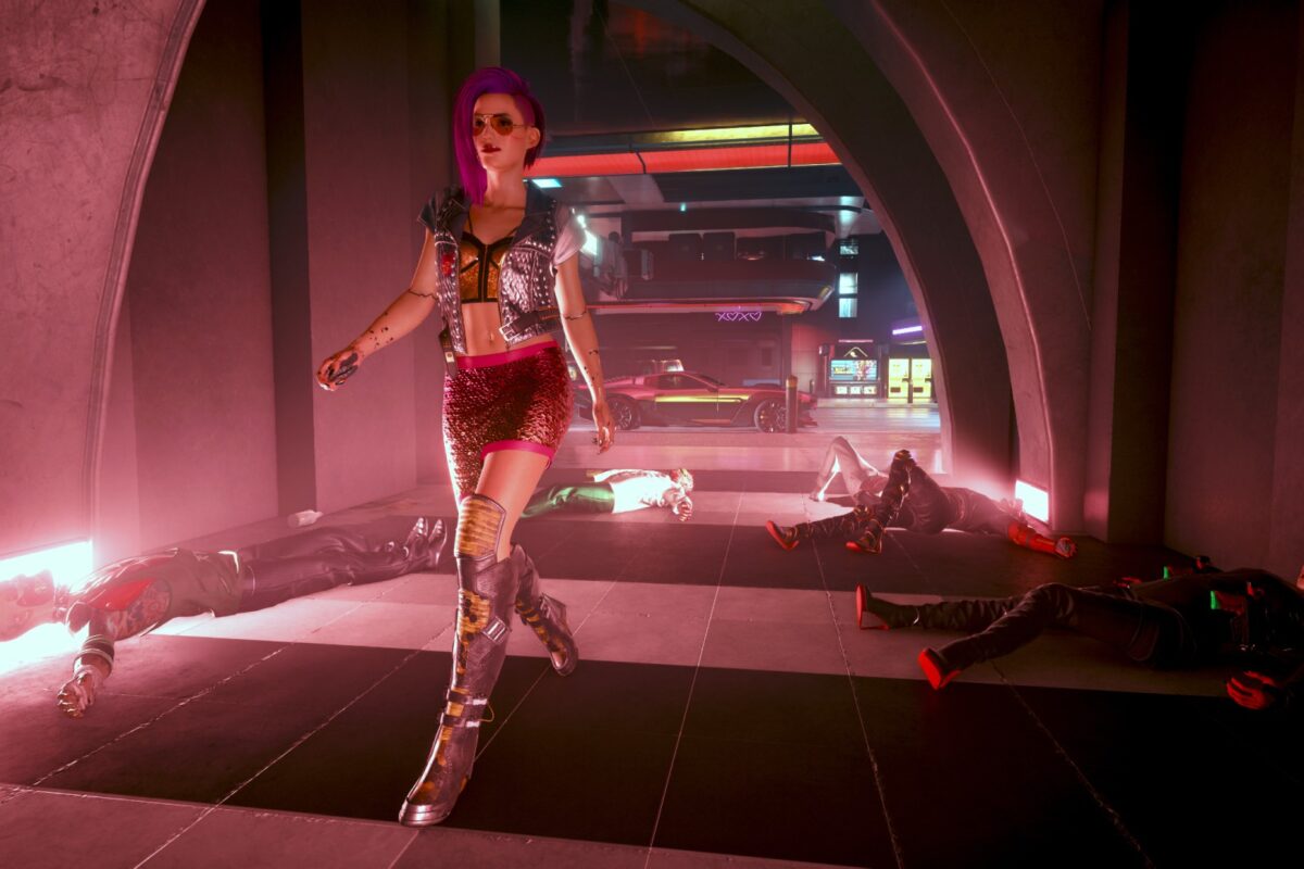 Cyberpunk V läuft geht durch eine rotbeleuchtete Gasse mit Leichen im Hintergrund. Screenshot aus dem Spiel Cyberpunk 2077 im Blog von Nastja der Mox.