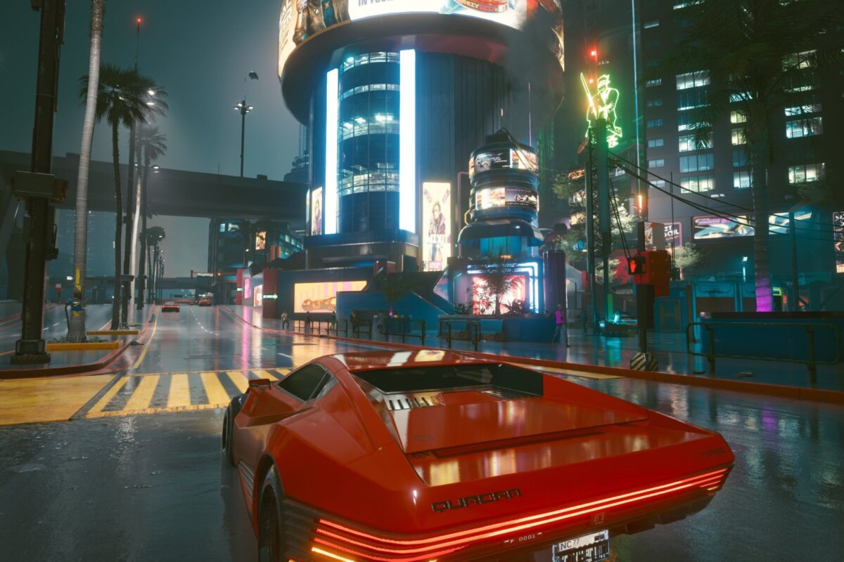 Roter Sportwagen vor der Skyline von Night City. Screenshot aus dem Spiel Cyberpunk 2077 im Blog von Nastja der Mox.