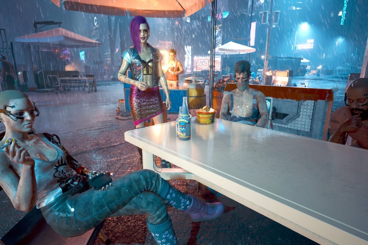 nachts im strömenden Regen am Campingtisch, im Neonschein von Night City. Screenshot aus dem Spiel Cyberpunk 2077 im Blog von Nastja der Mox.