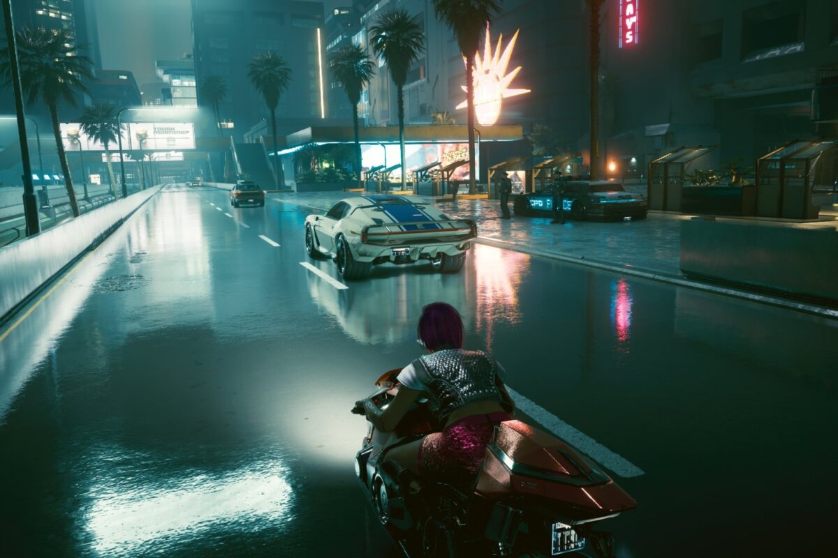 Auf dem Motorrad auf der Strasse von Night City. Screenshot aus dem Spiel Cyberpunk 2077 im Blog von Nastja der Mox.