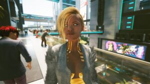 Aufgetakelte junge dynamisch wirkende Frau im Businessviertel. Screenshot aus dem Spiel Cyberpunk 2077 im Blog von Nastja der Mox. The Nameless of Night City ist eine Würdigung an die Ingame-NPCs.