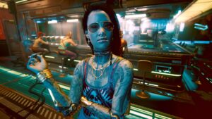Stark tatowierte Frau im Nachtclub. Screenshot aus dem Spiel Cyberpunk 2077 im Blog von Nastja der Mox. The Nameless of Night City ist eine Würdigung an die Ingame-NPCs.