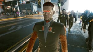 Mann mit Augenimplantat und Uniform. Screenshot aus dem Spiel Cyberpunk 2077 im Blog von Nastja der Mox. The Nameless of Night City ist eine Würdigung an die Ingame-NPCs.