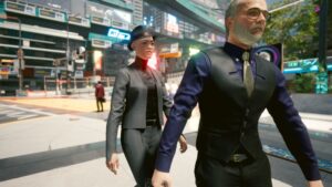 Frau in schwarzem Anzug und Hut nähert sich einem Passanten von hinten. Screenshot aus dem Spiel Cyberpunk 2077 im Blog von Nastja der Mox. The Nameless of Night City ist eine Würdigung an die Ingame-NPCs.