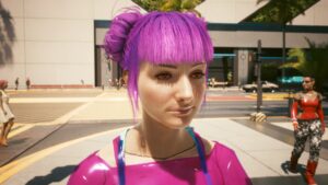 Jugendlich wirkende Frau in Rosa Frisur und Outfit mit blutunterlaufenen Augen. Screenshot aus dem Spiel Cyberpunk2077