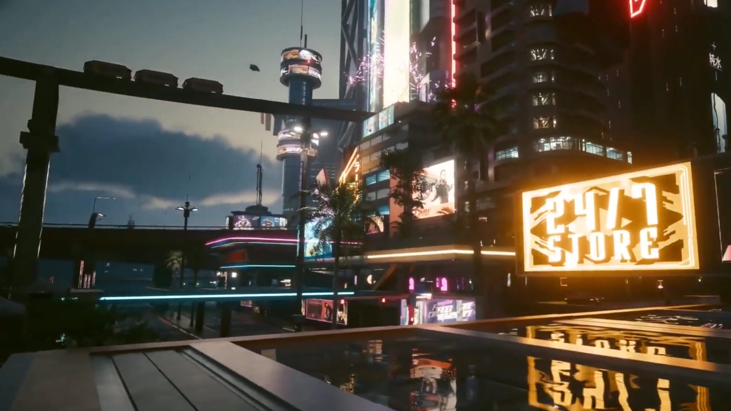 Skyline von Night City bei Nacht. Auf dem Motorrad durch Night City bei Nacht. Screenshot aus Cyberpunk 2077