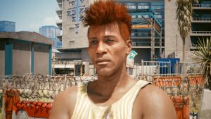 Porträt eines jungen Mannes in roten Haaren in Pacifica und belämmerten Gesichtsausdruck. Screenshot aus dem Spiel Cyberpunk 2077.